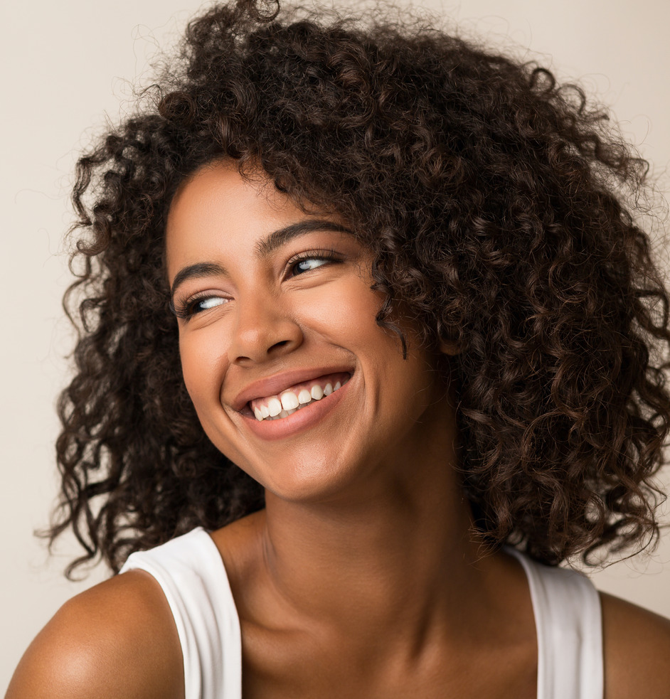 Photo of a smiling young woman with great skin
