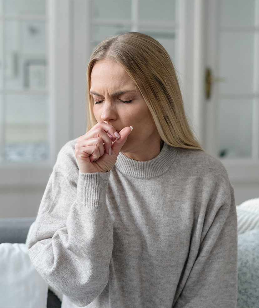 Photo of a blonde woman with a cold and cough