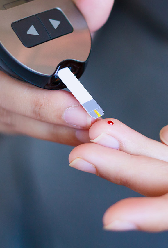 Photo of a person checking their blood sugar levels