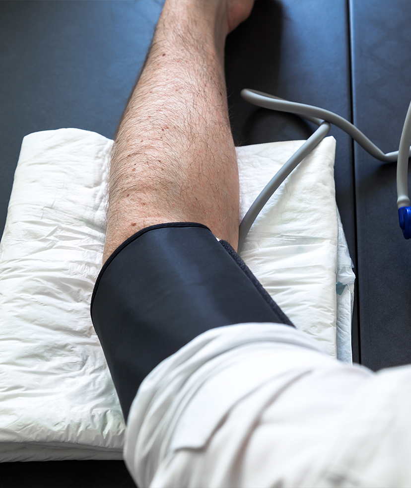 Photo of a man getting his blood pressure taken at a medical clinic