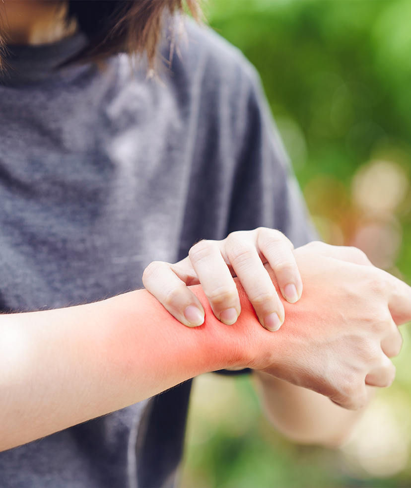 Photo of a woman dealing with the pain from a sprained wrist