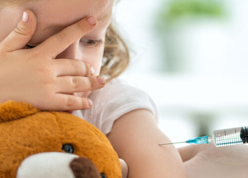 Photo of a child getting a vaccine shot