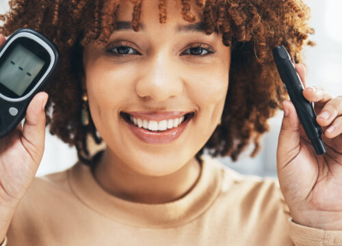Photo of a woman with diabetes checking her blood glucose levels