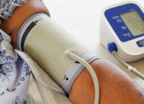 Photo of a woman being checked out for hypertension