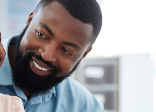Photo of a father and daughter at the doctor's office for a physical