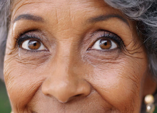 Photo of an older Black woman with facial wrinkles